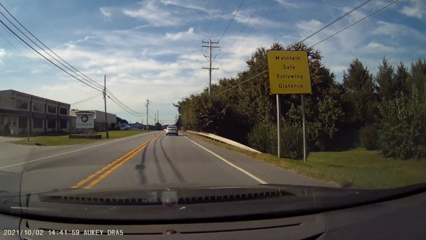 Sign stating 'Maintain Safe Following Distance' on PA-41.